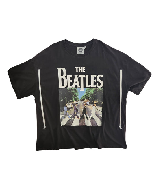 An XL upcycled black The Beatles t-shirt, designed for breastfeeding and pumping, features bold white band lettering above the Abbey Road album cover—blending sustainable style with nursing convenience.