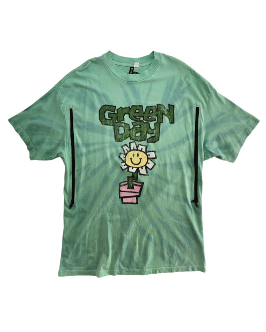 Upcycled XS H&M Green Day Band nursing t-shirt with a green tie-dye design, smiling white flower in a pink pot, cartoon Green Day lettering, and two front zippers for breastfeeding or stylish preloved wear.