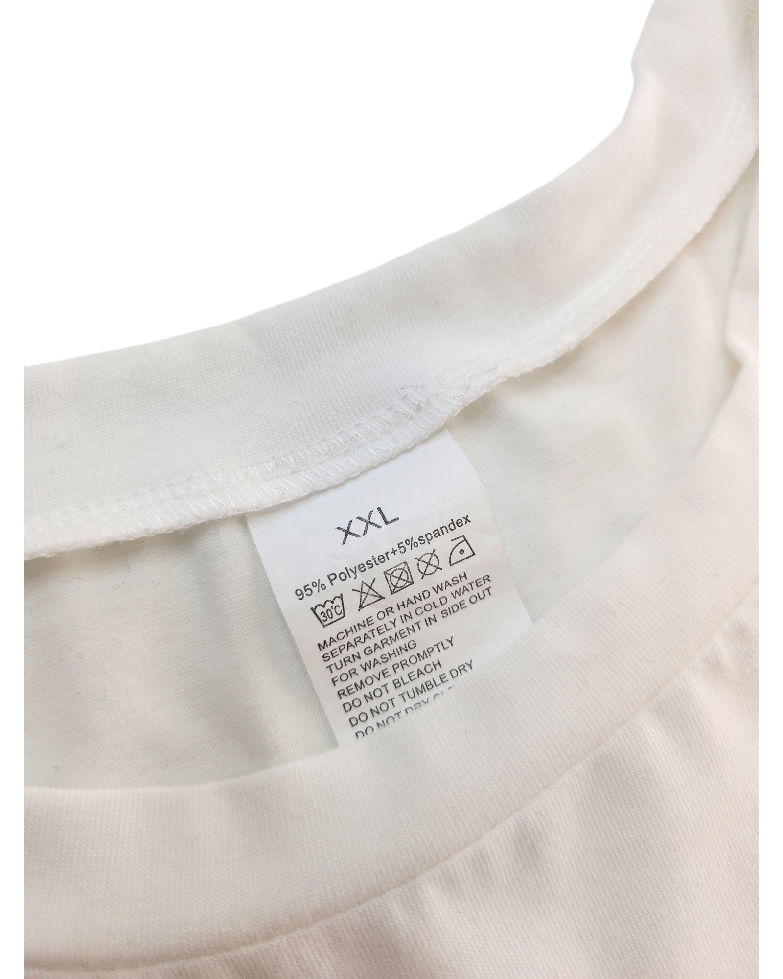 Close-up of the Upcycled Breastfeeding & Pumping Mama Coffee t-shirt in XXL, highlighting its collar tag with 95% polyester, 5% spandex fabric and care instructions—an eco-friendly, easy-care piece designed for sustainable living.