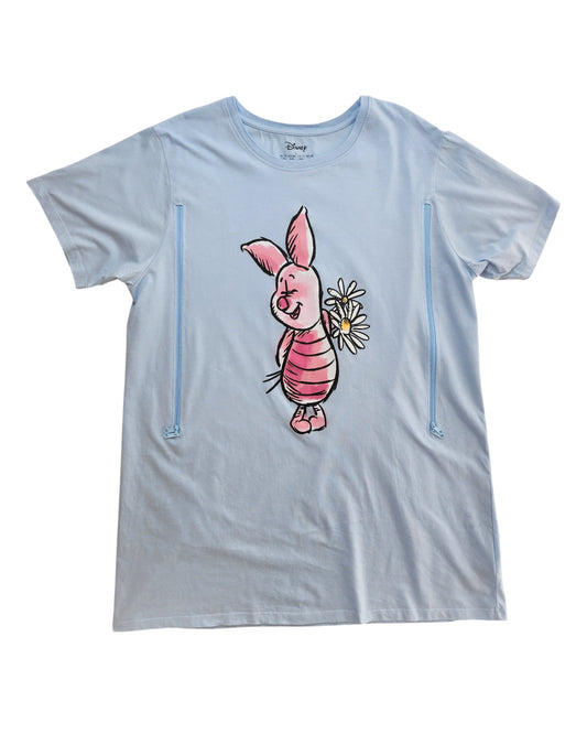 The Primark Upcycled Breastfeeding & Pumping Piglet Disney Nightshirt (L, UK14/16) features Piglet holding daisies. Made from eco-friendly materials, this nightshirt is ideal for fans seeking sustainable and practical nursing fashion.