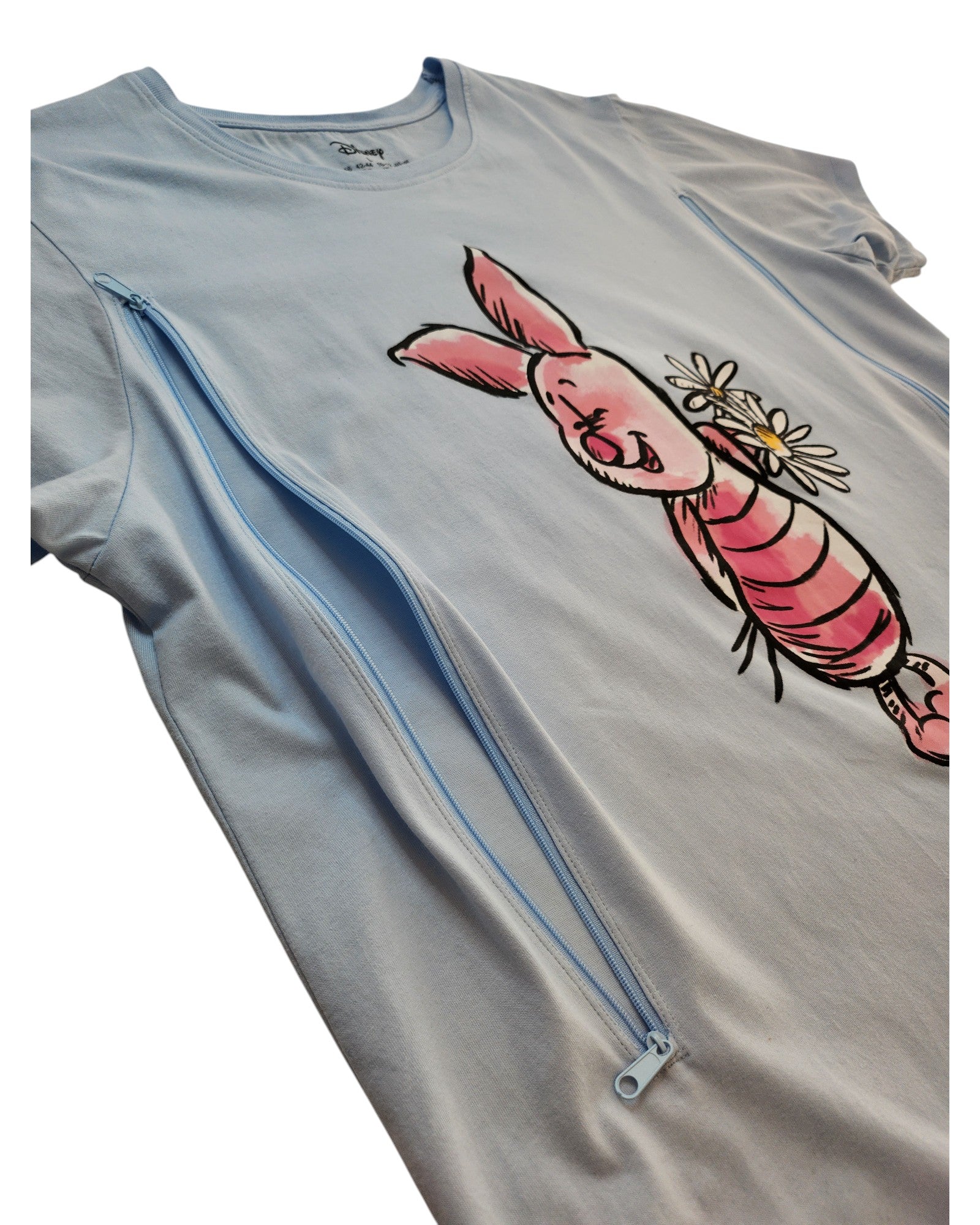 The Primark Upcycled Breastfeeding & Pumping Piglet Disney Nightshirt (L, UK14/16) features Piglet holding flowers and side zippers, making it a stylish and practical choice for nursing mothers.