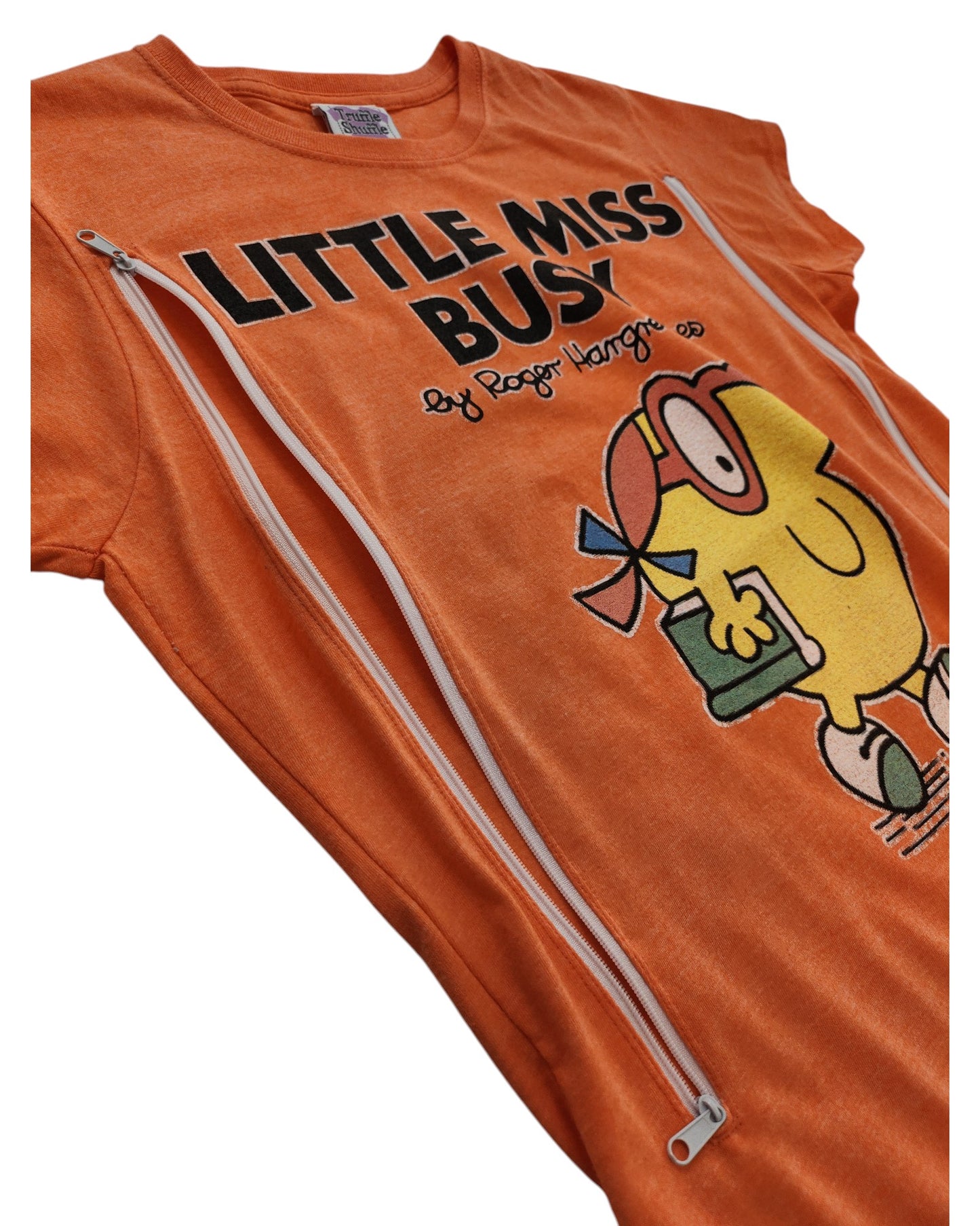 The Truffle Shuffle Upcycled Breastfeeding & Pumping Little Miss Busy t-shirt (M) features a cartoon graphic, white text, and two diagonal zippers for easy nursing access and comfort.