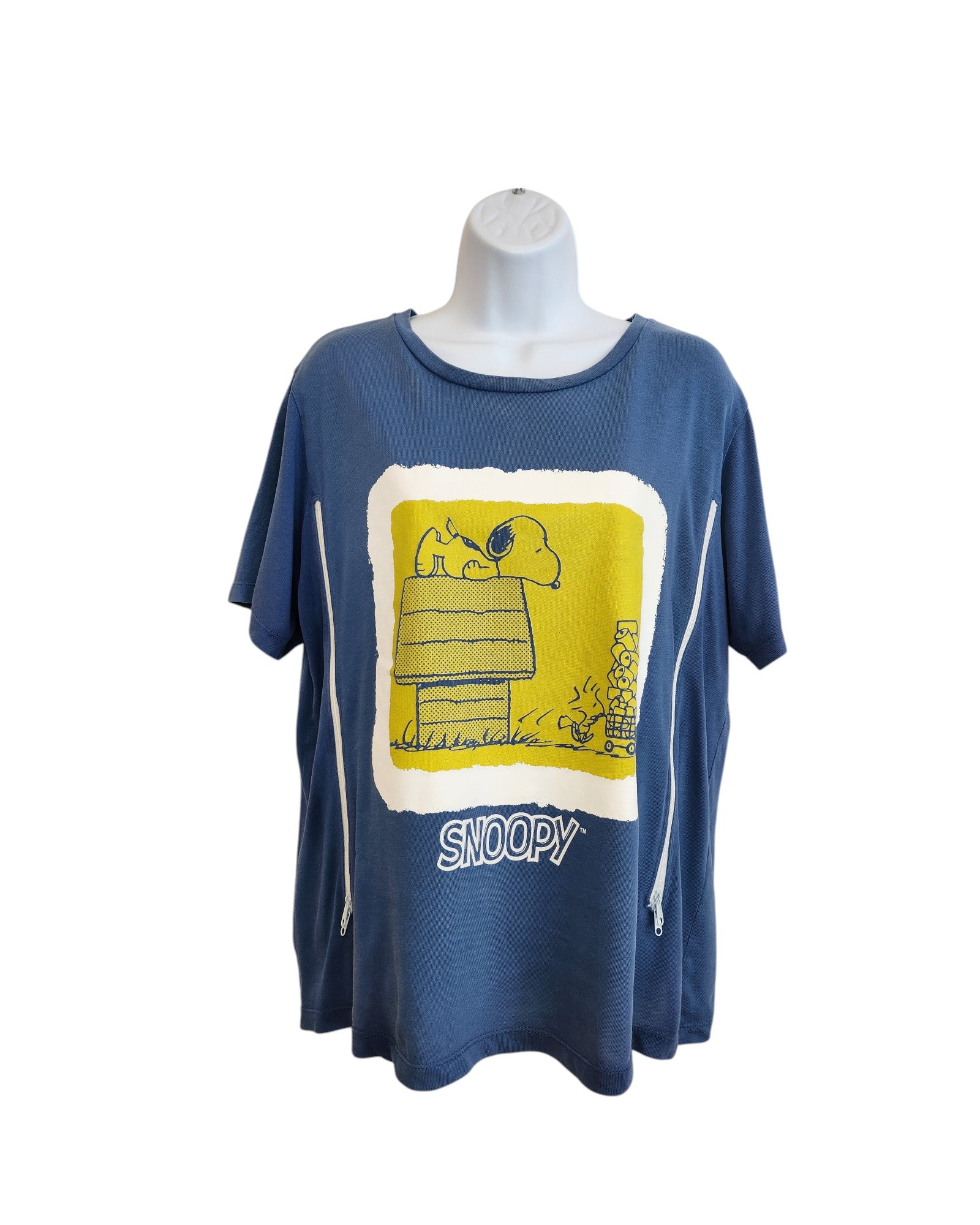 The ZARA Upcycled Breastfeeding & Pumping Snoopy Blue t-shirt (M) features a yellow and white graphic of Snoopy on his doghouse with Woodstock and SNOOPY below. Made from upcycled clothing, shown on a white mannequin torso.