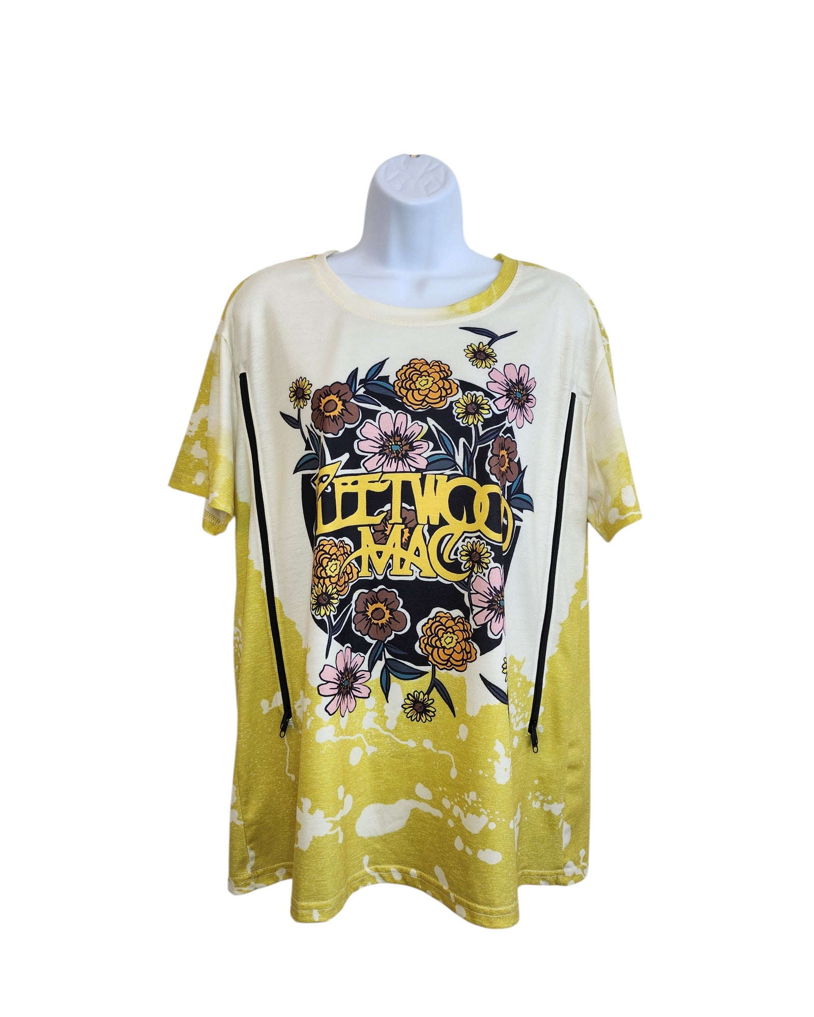 The Upcycled Breastfeeding & Pumping Lime Fleetwood Mac t-shirt XL features yellow and white tie-dye, a Fleetwood Mac logo with colorful flowers and bees, and is eco-friendly. Displayed on a plain mannequin against a white background. Brand unknown.