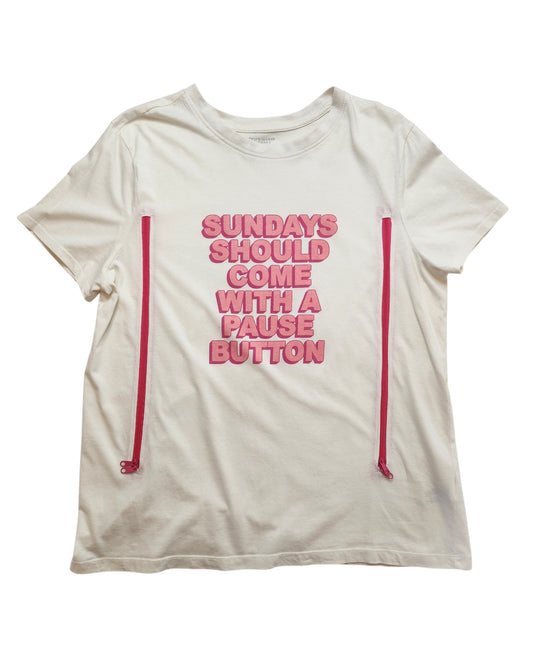 Primark’s Upcycled Breastfeeding & Pumping Sundays Pause Button t-shirt (L, UK14/16) is a white tee with pink side zippers for easy nursing and features “SUNDAYS SHOULD COME WITH A PAUSE BUTTON” in pink text on the front.