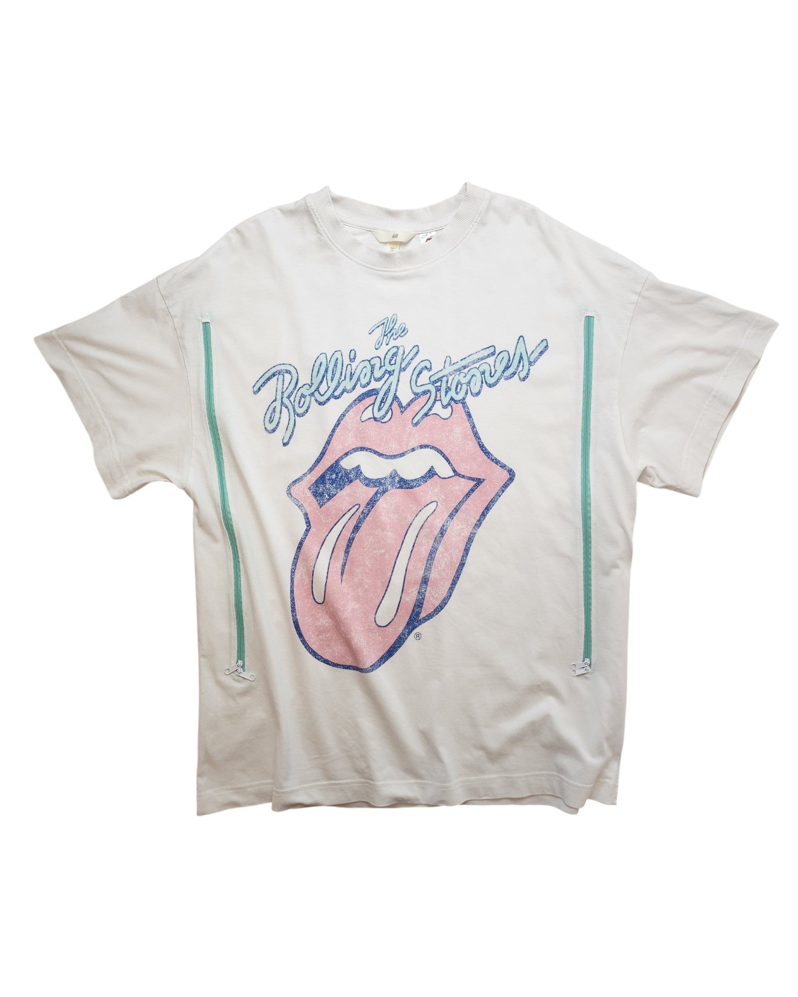 This upcycled H&M Rolling Stones T-shirt in white/blue (size L) features the iconic logo with a pink tongue, blue text, and teal stripes. Designed for breastfeeding and pumping, it adds a unique twist to your wardrobe with preloved fashion flair.