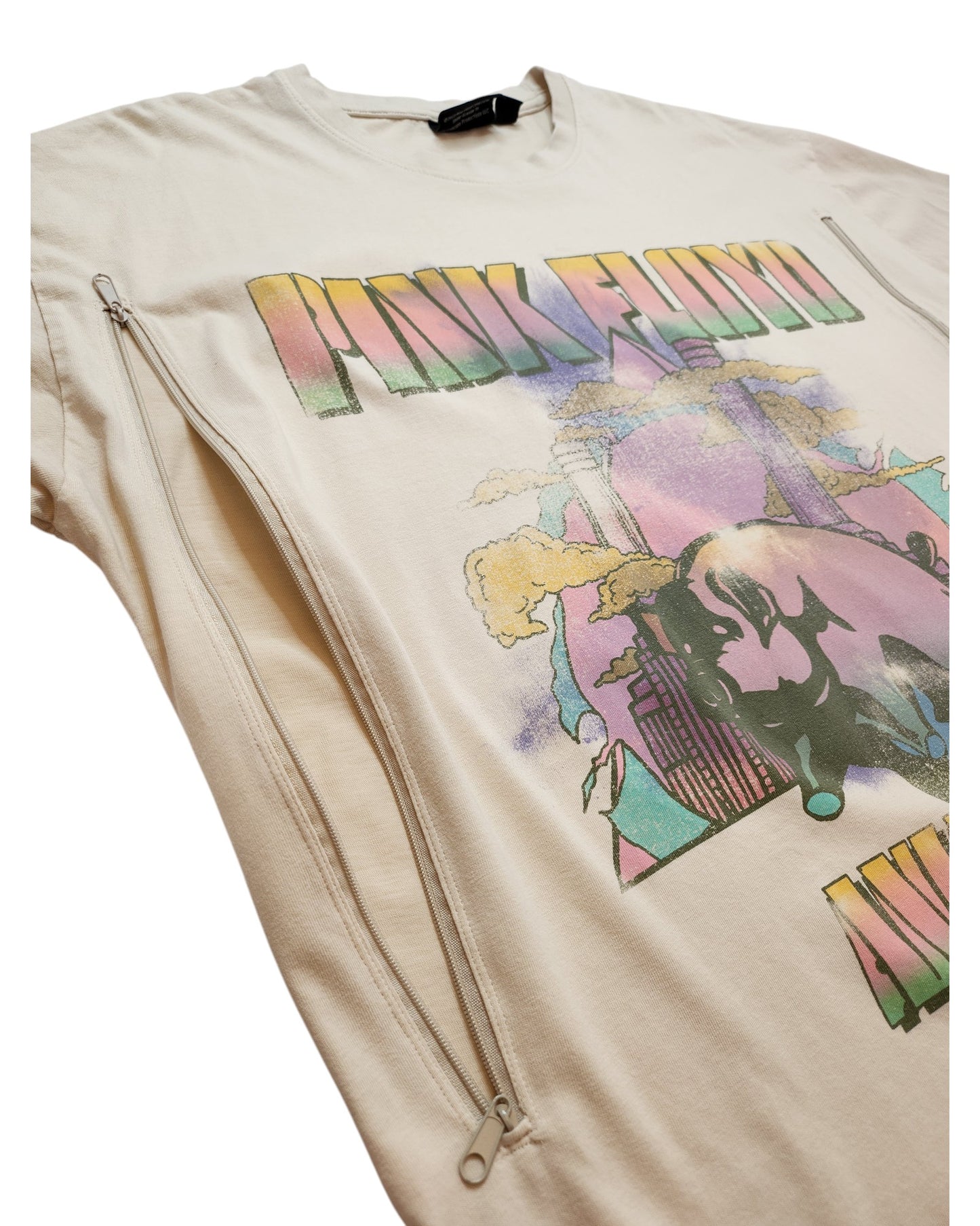 The Primark Upcycled Breastfeeding & Pumping Cream Pink Floyd t-shirt (M, UK12/14) features pastel graphics, large text, and two side zippers for easy nursing access. Shown laid flat on a white background.