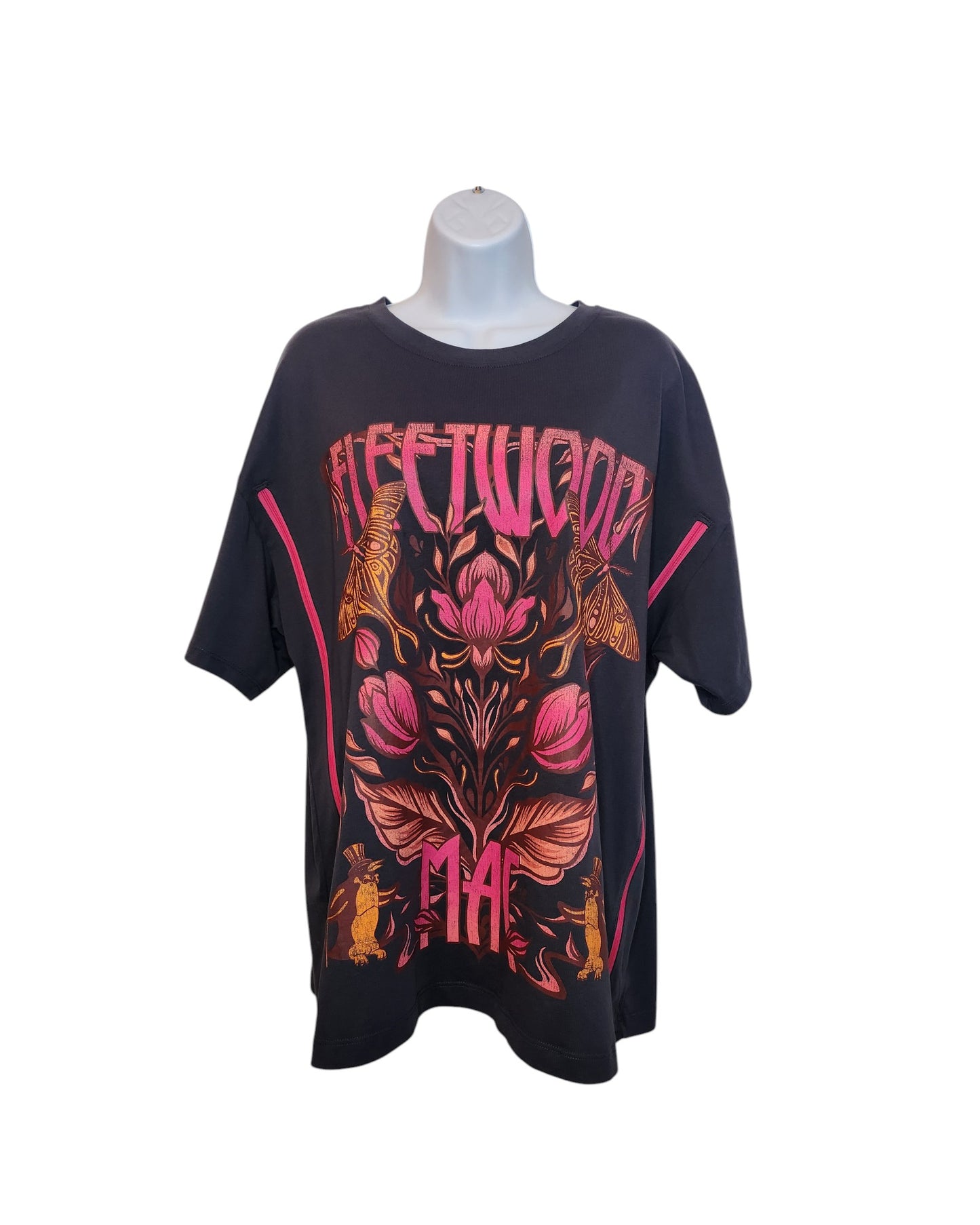 Displayed on a mannequin, this Upcycled Primark grey Fleetwood Mac floral band t-shirt (size L/UK14/16) features breastfeeding & pumping access, colorful floral graphics, and two small rabbits near the bottom. Made from preloved clothing.