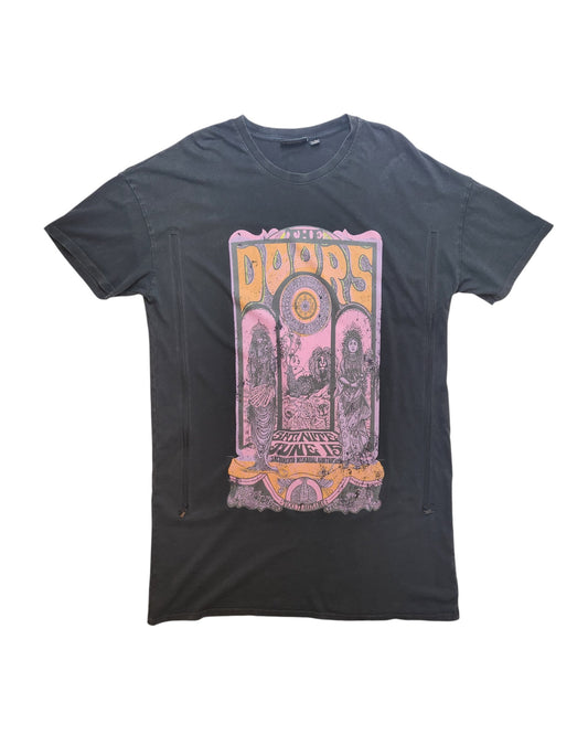 The Primark Upcycled Breastfeeding & Pumping The Doors Band t-shirt dress (size S, UK10/12) features a vibrant psychedelic Doors poster graphic in pink, yellow, and orange on black—eco-friendly fashion made from upcycled clothing.