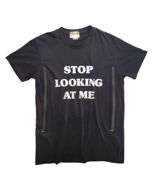 The Hoxton Chic Upcycled Breastfeeding & Pumping Stop Looking t-shirt (M) is made from eco-friendly materials and features bold white STOP LOOKING AT ME text plus two vertical zippers near the bottom for nursing or pumping ease.