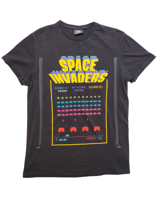 The Cedar Wood State Upcycled Breastfeeding & Pumping Space Invaders T-shirt (M) features colorful pixelated alien graphics, spaceships, scores, and captions on black eco-friendly upcycled fabric.