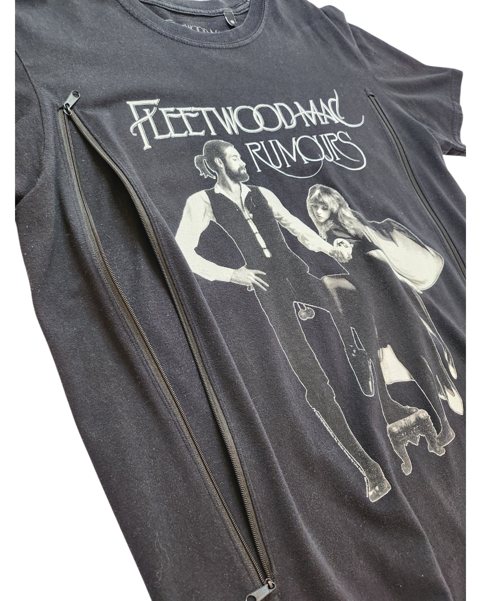 The Upcycled Fleetwood Mac Rumours Black T-shirt (UK10) features album artwork with two band members in black and white beneath the band name, plus side vertical zippers for easy breastfeeding or pumping. Perfect for stylish, practical nursing wear.