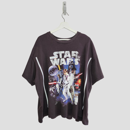 An upcycled H&M Grey Star Wars nursing & pumping t-shirt (XL), featuring character and spaceship graphics, made from preloved materials. Displayed on a white hanger against a plain background.