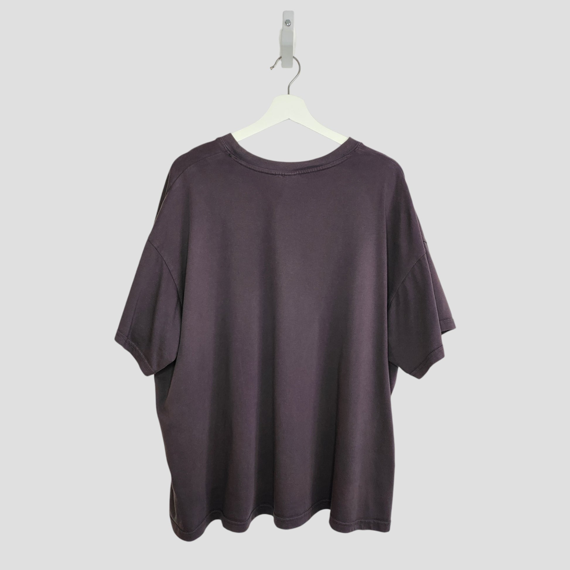 An upcycled H&M Breastfeeding & Pumping Grey Star Wars T-shirt (XL) hangs on a white hanger, shown from the back against a light gray background.