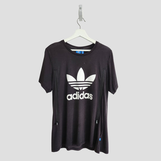 An upcycled Adidas black and white breastfeeding & pumping T-shirt (UK14) with trefoil logo and adidas text on the front, shown on a white hanger against a light gray background.