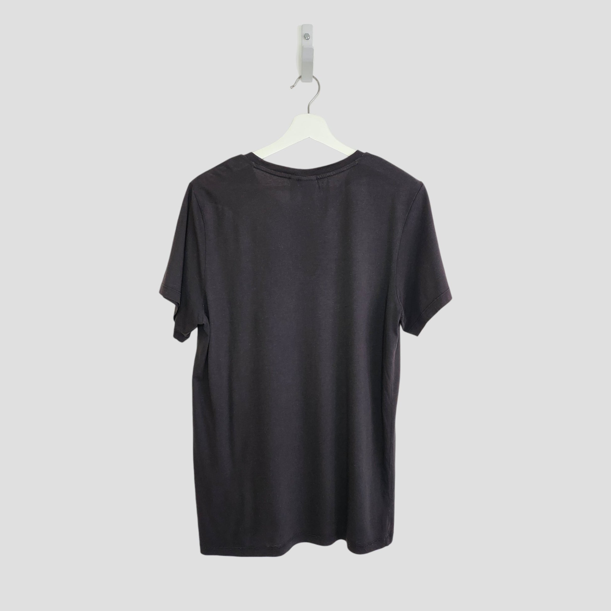 An upcycled Adidas breastfeeding and pumping black/white t-shirt (UK14) is displayed on a white hanger against a light gray background, shown from the back.