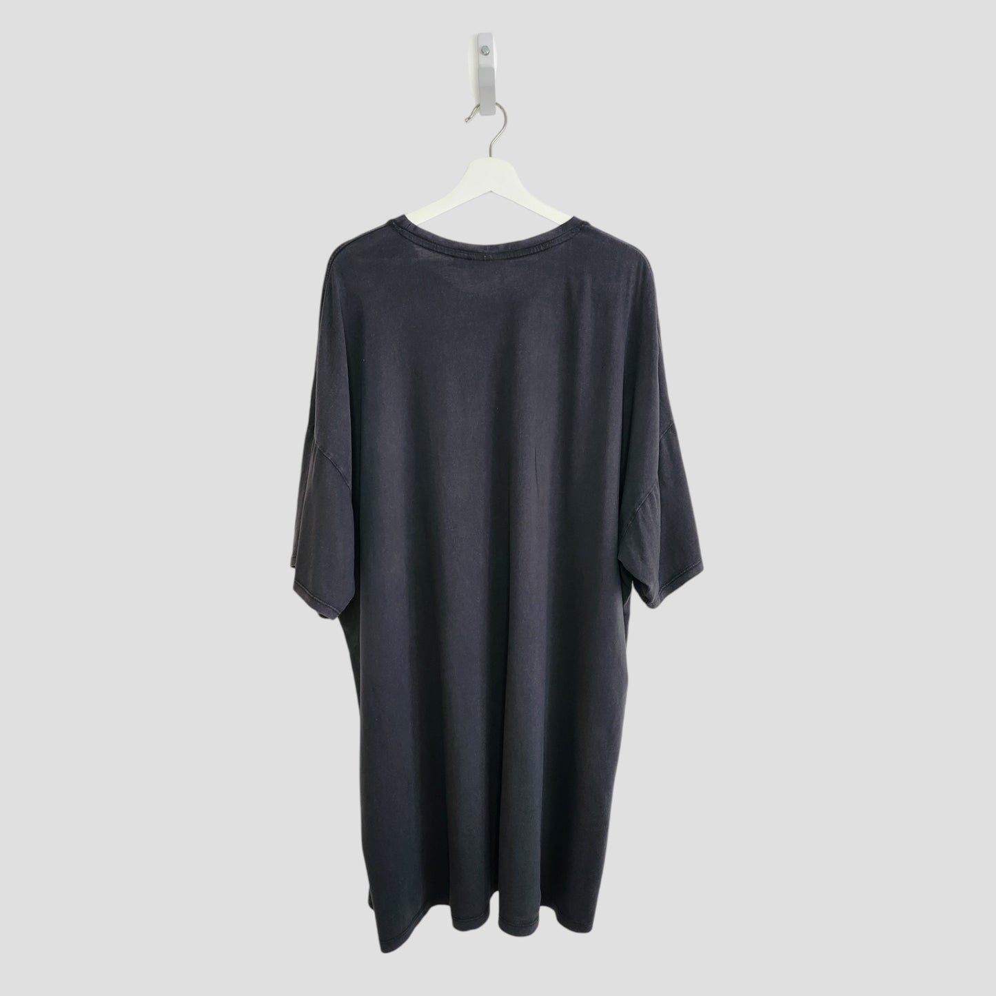 A preloved black Primark Upcycled Breastfeeding & Pumping AC/DC Faces t-shirt dress (XL, UK18/20) is shown on a white hanger against a plain light gray background, displaying the back view.