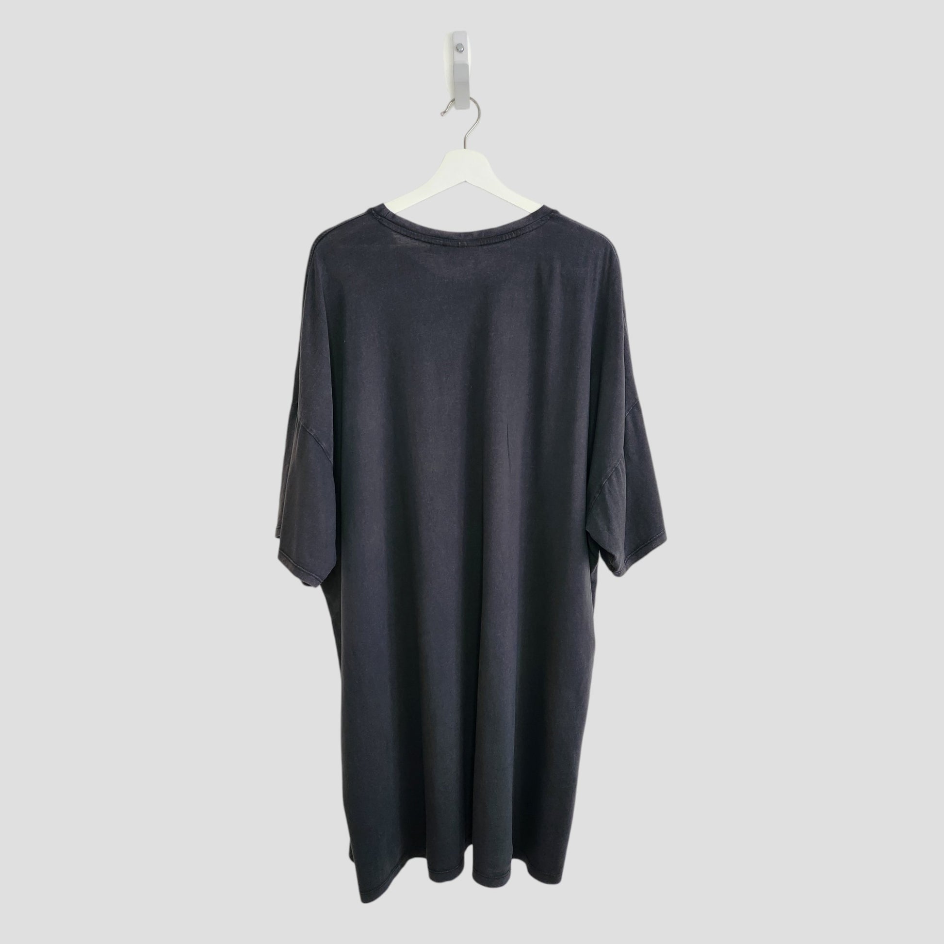 A preloved black Primark Upcycled Breastfeeding & Pumping AC/DC Faces t-shirt dress (XL, UK18/20) is shown on a white hanger against a plain light gray background, displaying the back view.