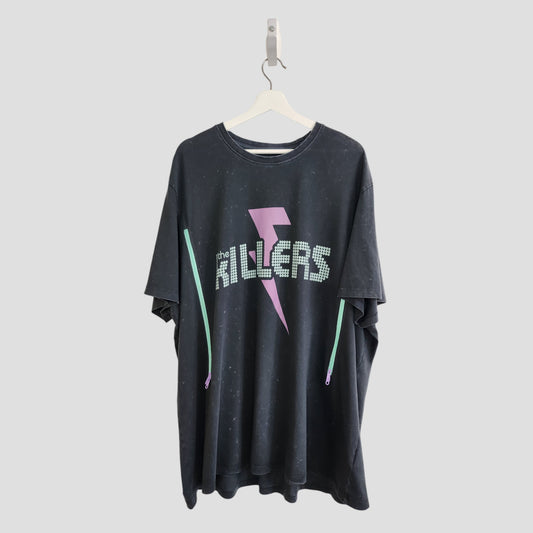 An upcycled 3XL black The Killers band T-shirt for breastfeeding and pumping, featuring white dotted lettering and a pink lightning bolt—a unique find for preloved fashion fans.
