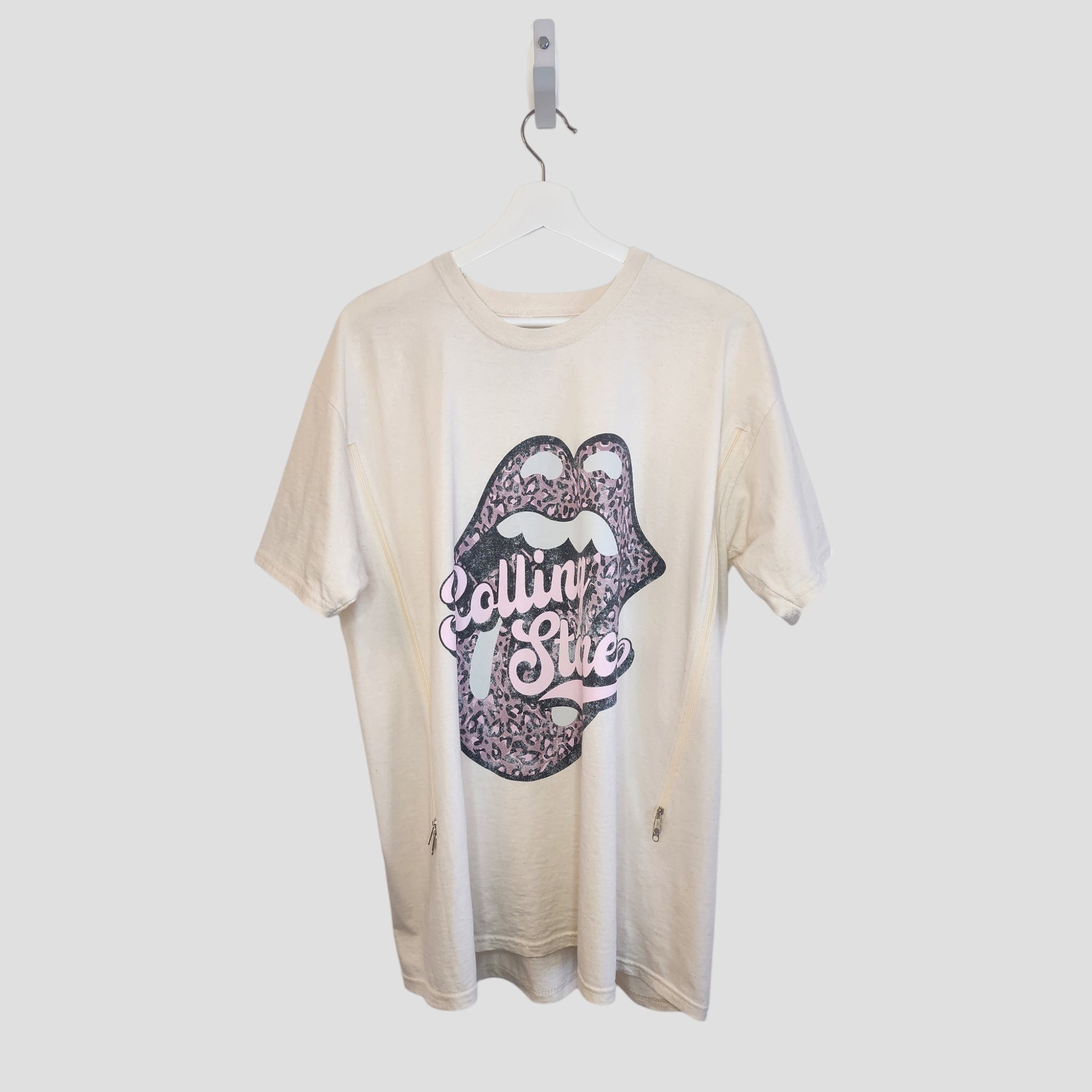 An upcycled XL cream/pink Rolling Stones band t-shirt for breastfeeding and pumping, featuring a lips graphic—an affordable preloved maternity find from The Rolling Stones.