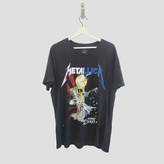 A preloved GAP Metallica upcycled breastfeeding and pumping T-shirt (size L) hangs on a white hanger, featuring colorful skull and lightning artwork with the band’s logo across the chest.