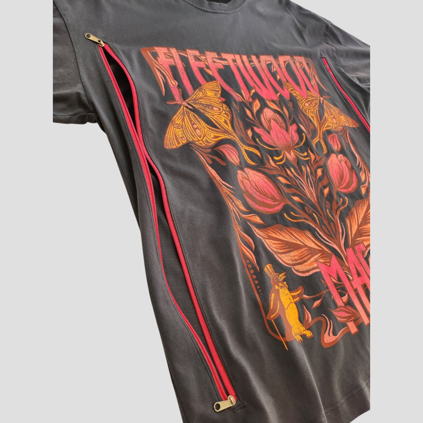 Primark Upcycled Breastfeeding Grey Floral Fleetwood Mac Band T-shirt (S/UK10-12) with floral and band graphic. Features two red diagonal zippers from underarm to hem on both sides for easy nursing and pumping access.