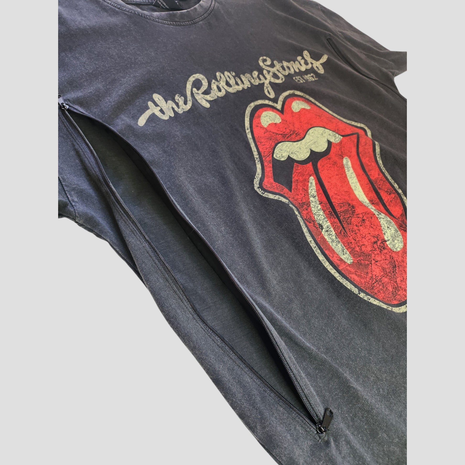 An upcycled Primark oversized t-shirt dress in grey/red featuring The Rolling Stones logo, with a discreet left side zipper for easy nursing or pumping. Size S (UK10/12).