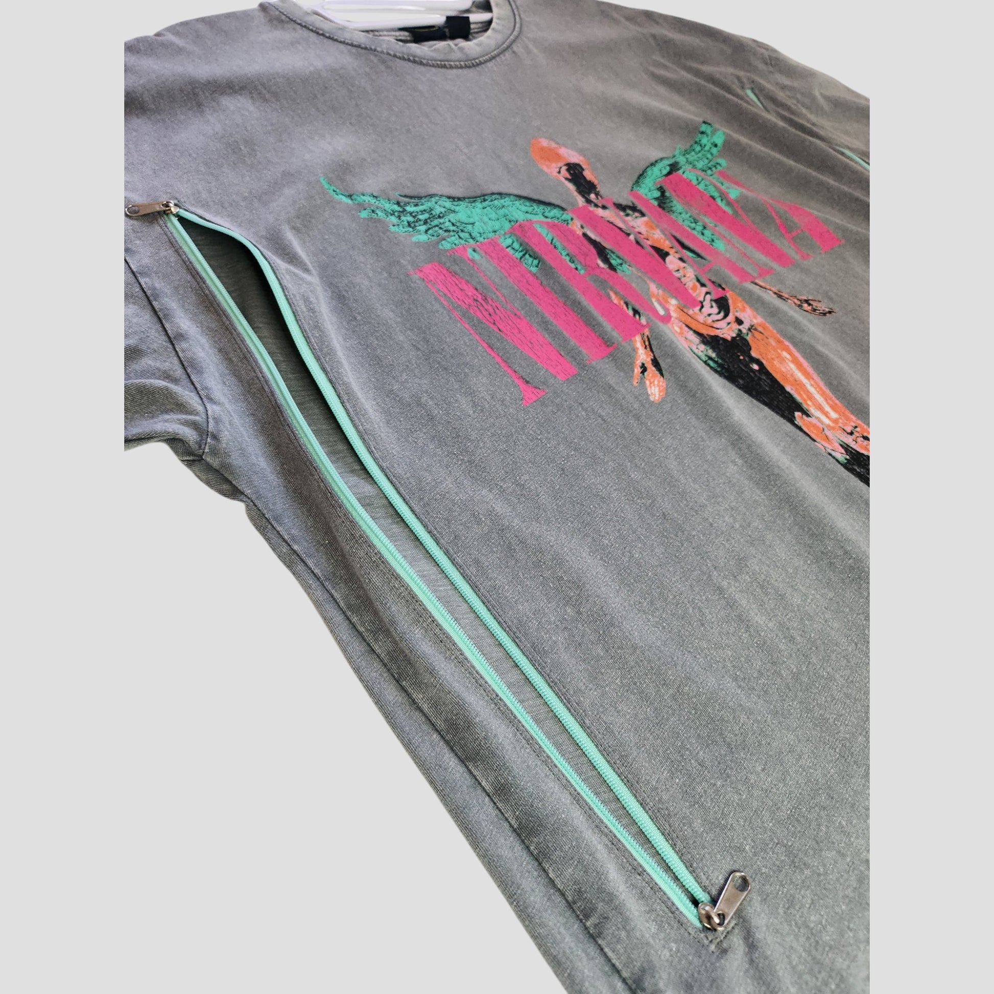 Primark's Upcycled Breastfeeding & Pumping Nirvana Band Angel t-shirt dress (Grey/Pink, S UK10/12) features a colorful angel graphic and turquoise side zippers, perfect as eco-friendly maternity or stylish nursing wear.