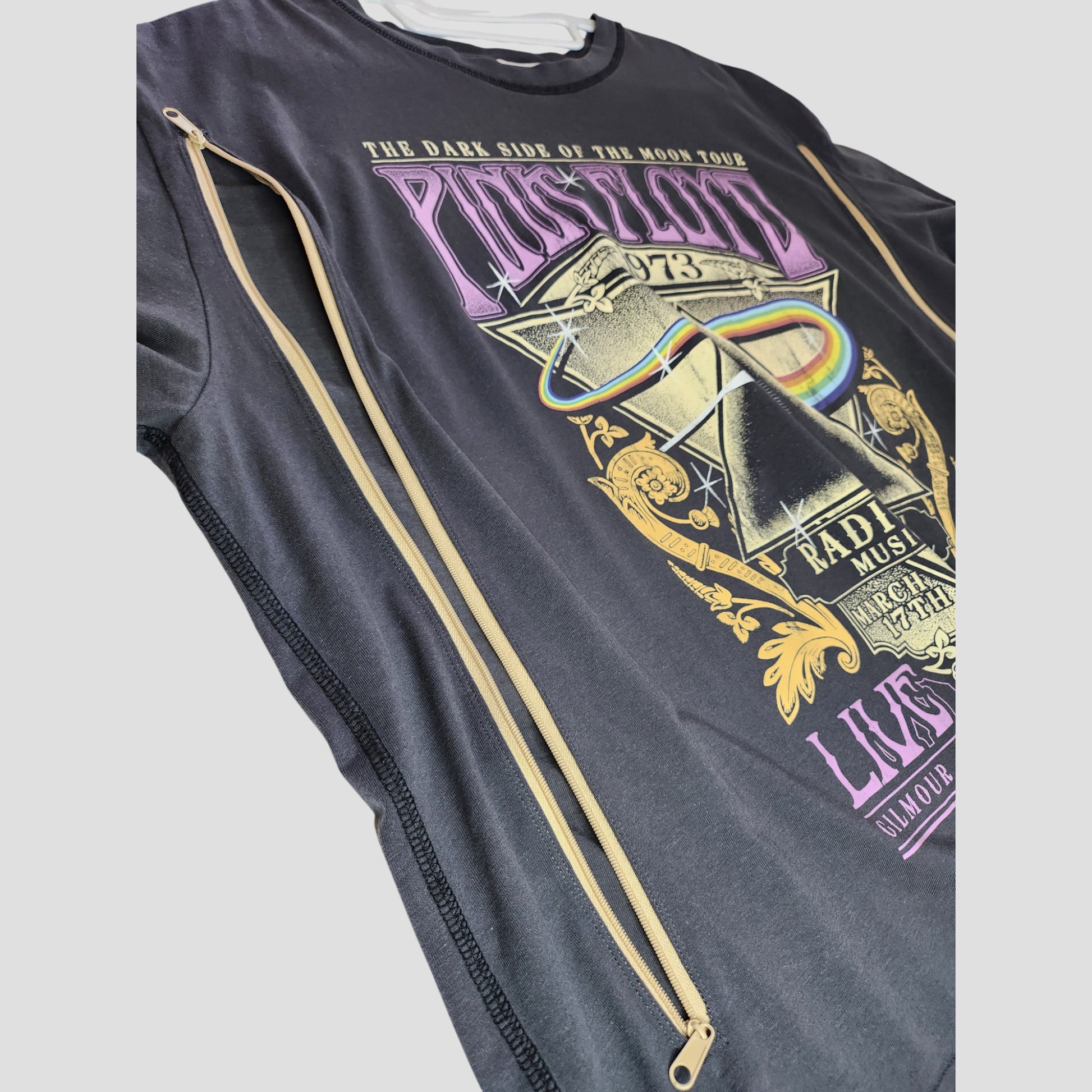 An upcycled H&M breastfeeding and pumping t-shirt (XL), featuring Pink Floyd’s rainbow album art on grey—designed for modern moms seeking style and function.