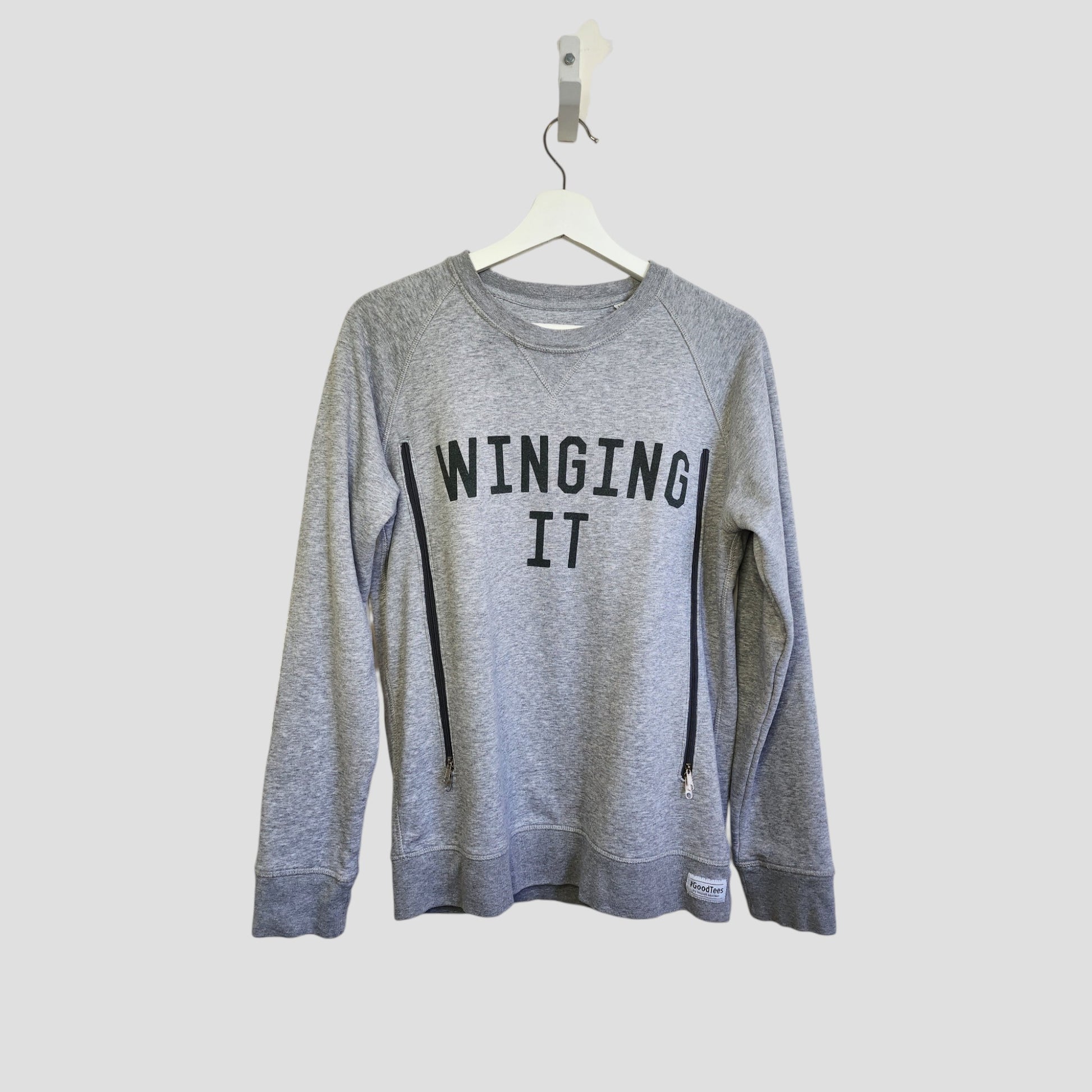 The Selfish Mother Upcycled Breastfeeding & Pumping Grey WINGING IT Sweatshirt (M) features bold black lettering and eco-friendly materials—ideal for nursing moms seeking style and sustainability.