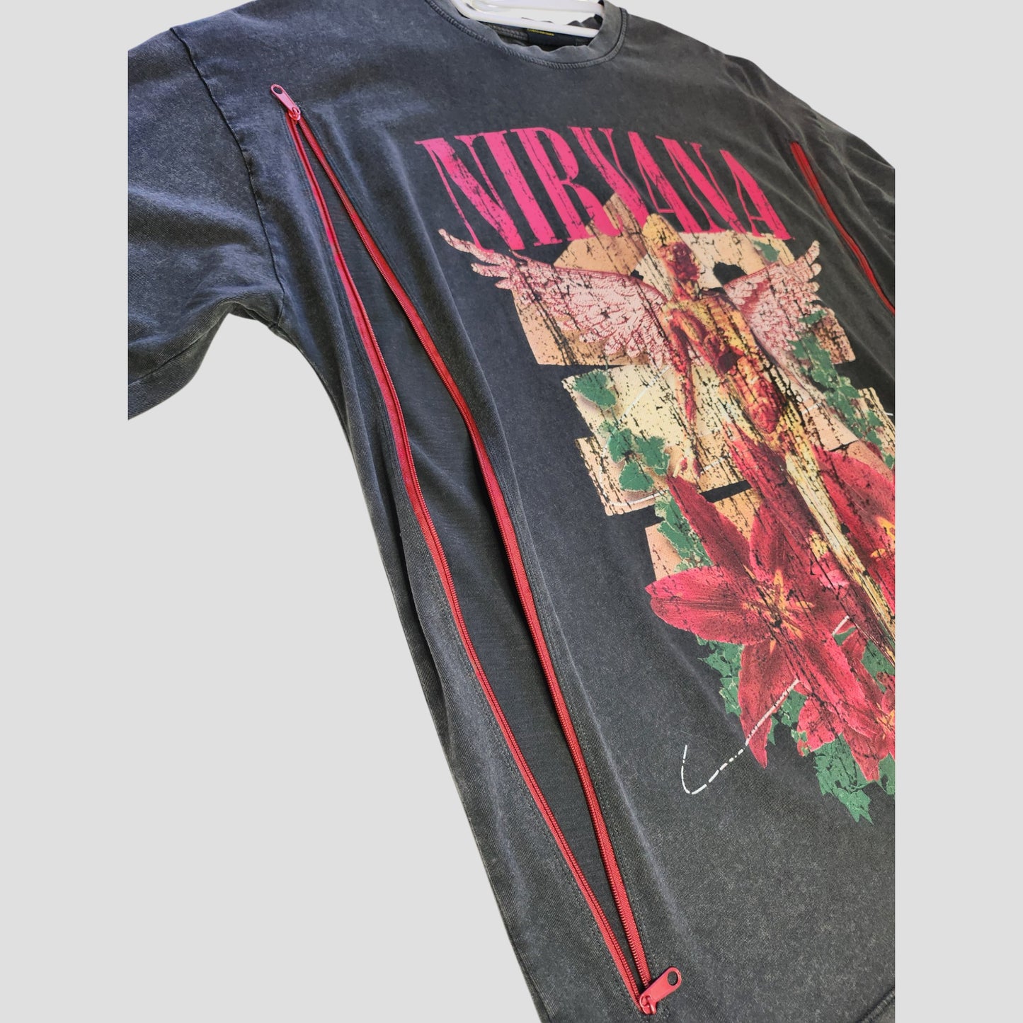 Primark Upcycled Breastfeeding & Pumping Nirvana Band Oversized Dark Grey Floral T-shirt (UK10/12) features a winged figure, red flowers, and distressed details. Eco-friendly design for nursing and pumping.