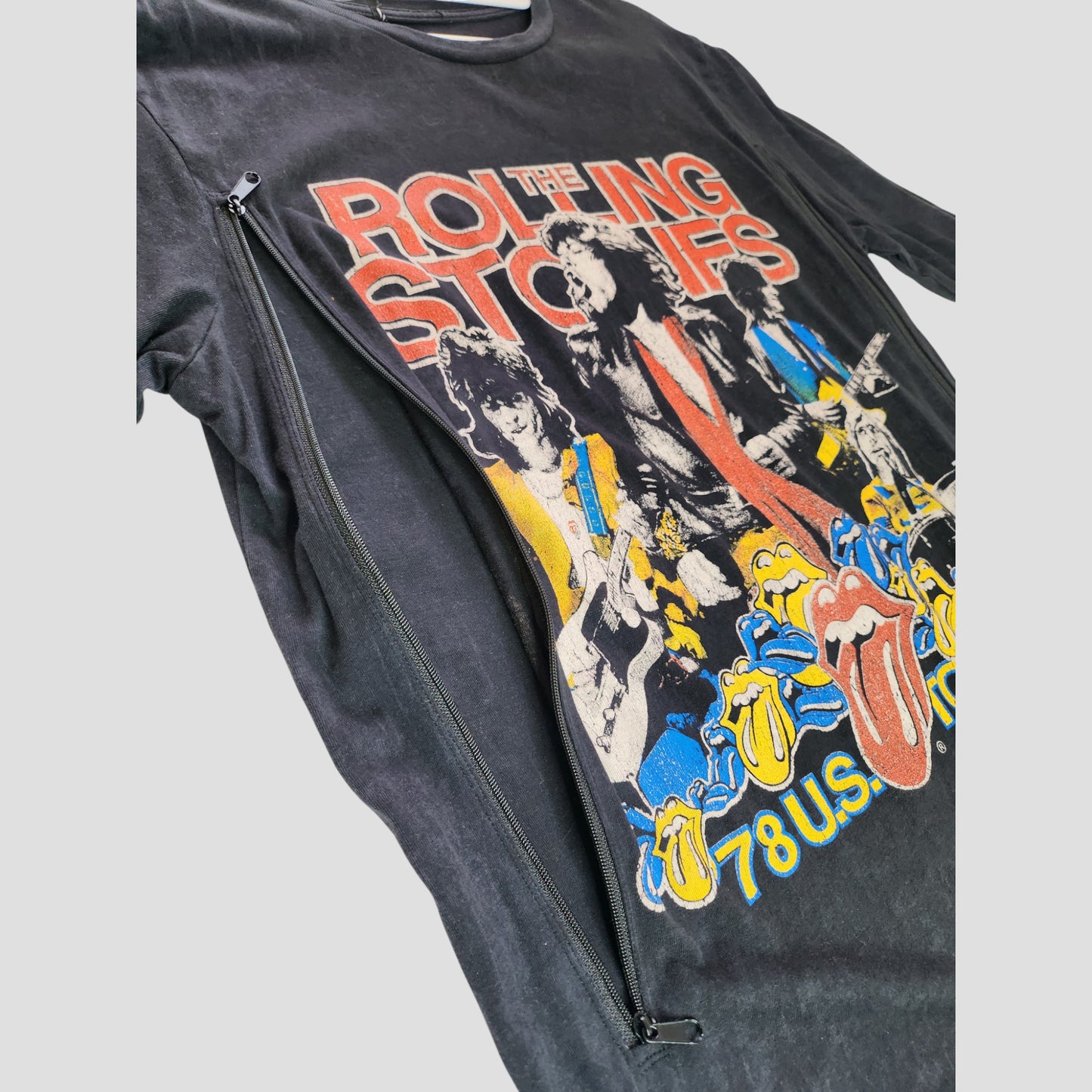 A black Boohoo The Rolling Stones upcycled t-shirt dress (UK8) for breastfeeding and pumping, featuring a colorful band graphic and 78 U.S. Tour text—crafted from preloved clothing for an eco-friendly touch.