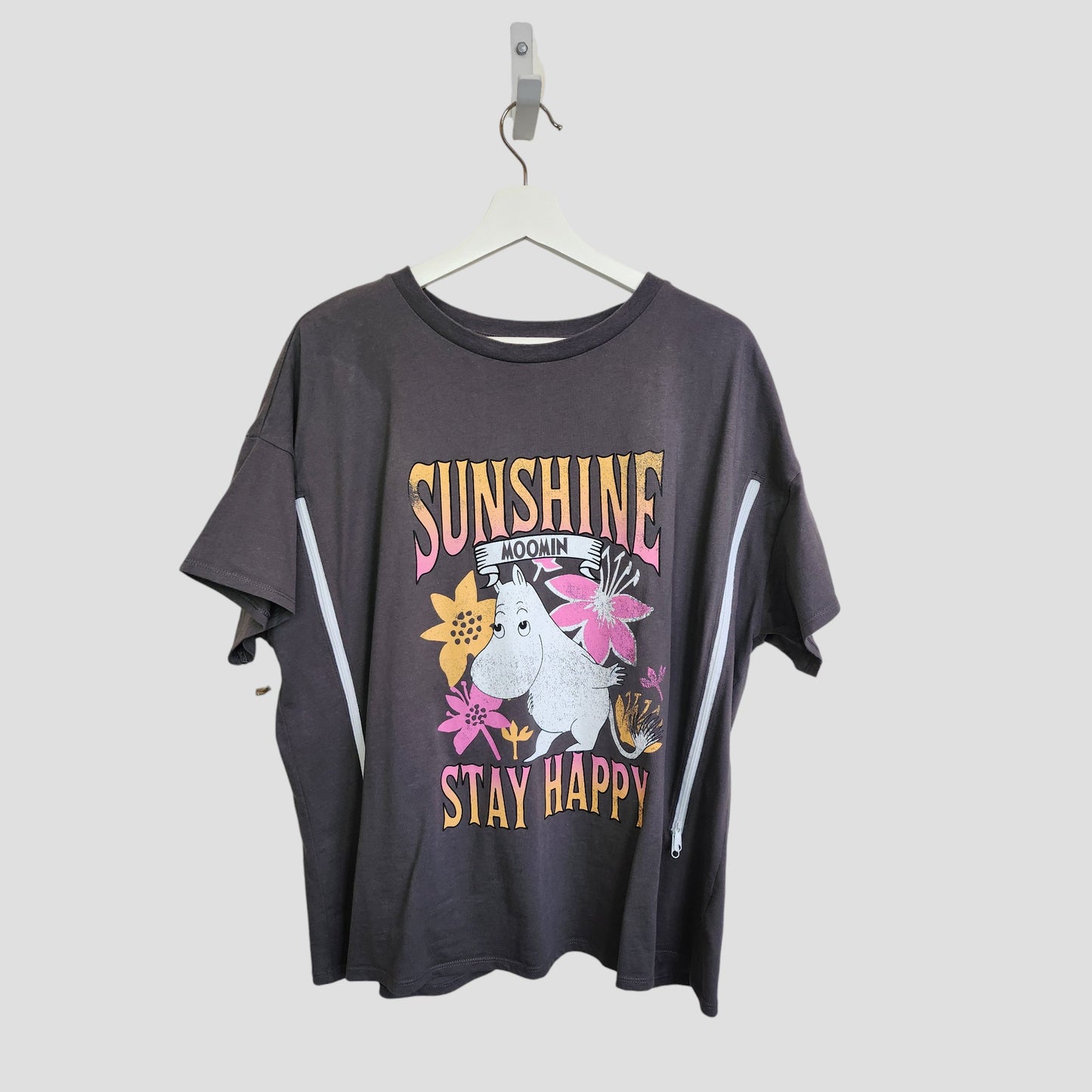 The George Upcycled Breastfeeding & Pumping Sunshine Moomin T-shirt UK20 features a dark gray design with a Moomin character, pink and yellow flowers, and the words SUNSHINE and STAY HAPPY—ideal for eco-friendly maternity style.