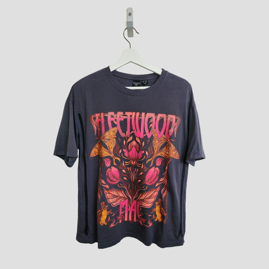 A grey upcycled Primark Fleetwood Mac oversized breastfeeding t-shirt (XS, UK8/10) features bold pink and orange band lettering with floral graphics—perfect for nursing and pumping.