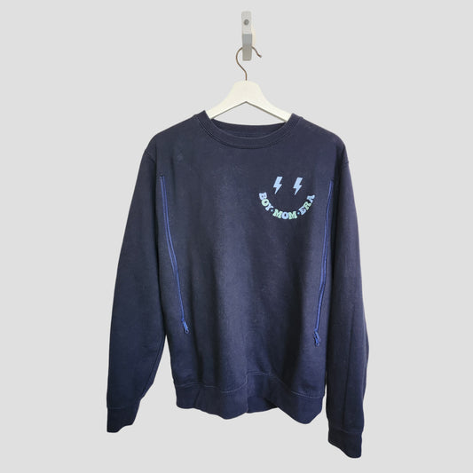 The My Rocking Kids Upcycled Breastfeeding & Pumping Boy Mom Era Sweatshirt (M, 100142) is navy blue with two lightning bolts and "BOY MOM ERA" in light blue on the chest, shown on a white hanger against a plain light background.