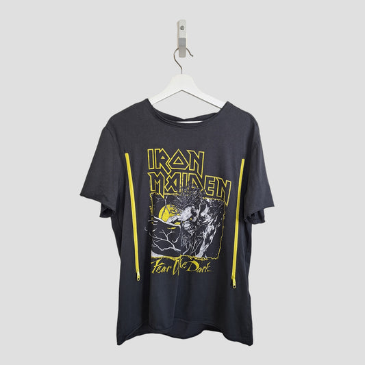 An upcycled Amplified Iron Maiden "Fear the Dark" breastfeeding & pumping t-shirt in grey and yellow (size L) features bold band graphics and two vertical yellow zippers along the sides, shown on a white hanger against a light gray background.