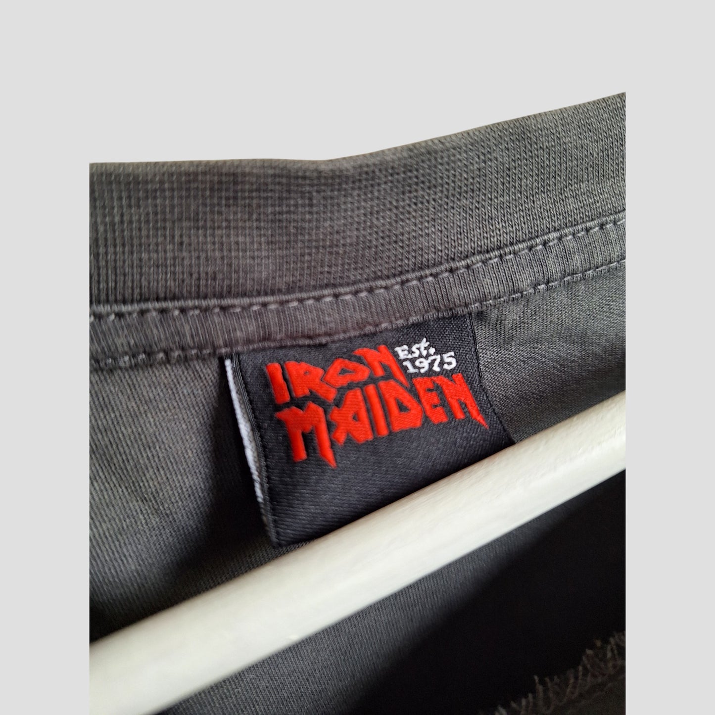 The George Upcycled Breastfeeding & Pumping Grey/Red Glitter Iron Maiden Band t-shirt UK18 (100400) offers modern moms an eco-friendly nursing wear option with a unique, repurposed band tee style.