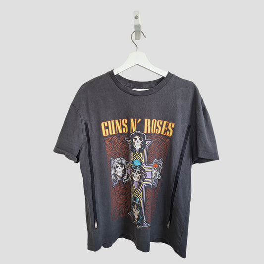 Primark's Upcycled Breastfeeding & Pumping Guns N' Roses Cross Band t-shirt (M) features a bold, colorful cross with skull band members and yellow band name—crafted from upcycled nursing wear for a sustainable, unique style.