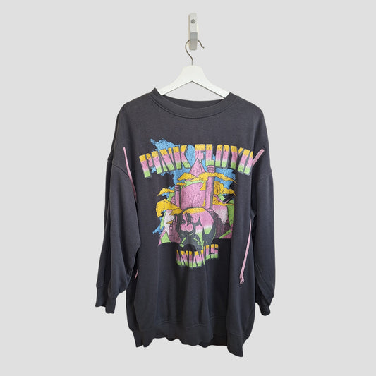 The H&M Upcycled Breastfeeding & Pumping Pink Floyd Band Oversized Sweatshirt M (100114) features a colorful abstract front graphic and band name, offering relaxed maternity comfort in eco-friendly, upcycled style. Hangs on a white hanger.