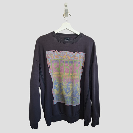 Primark's Upcycled Breastfeeding & Pumping Grey Pink Floyd Band Sweatshirt (M, UK12/14) is crafted from repurposed nursing wear for an eco-friendly touch, featuring a bold graphic and hanging on a white hanger against a light background.