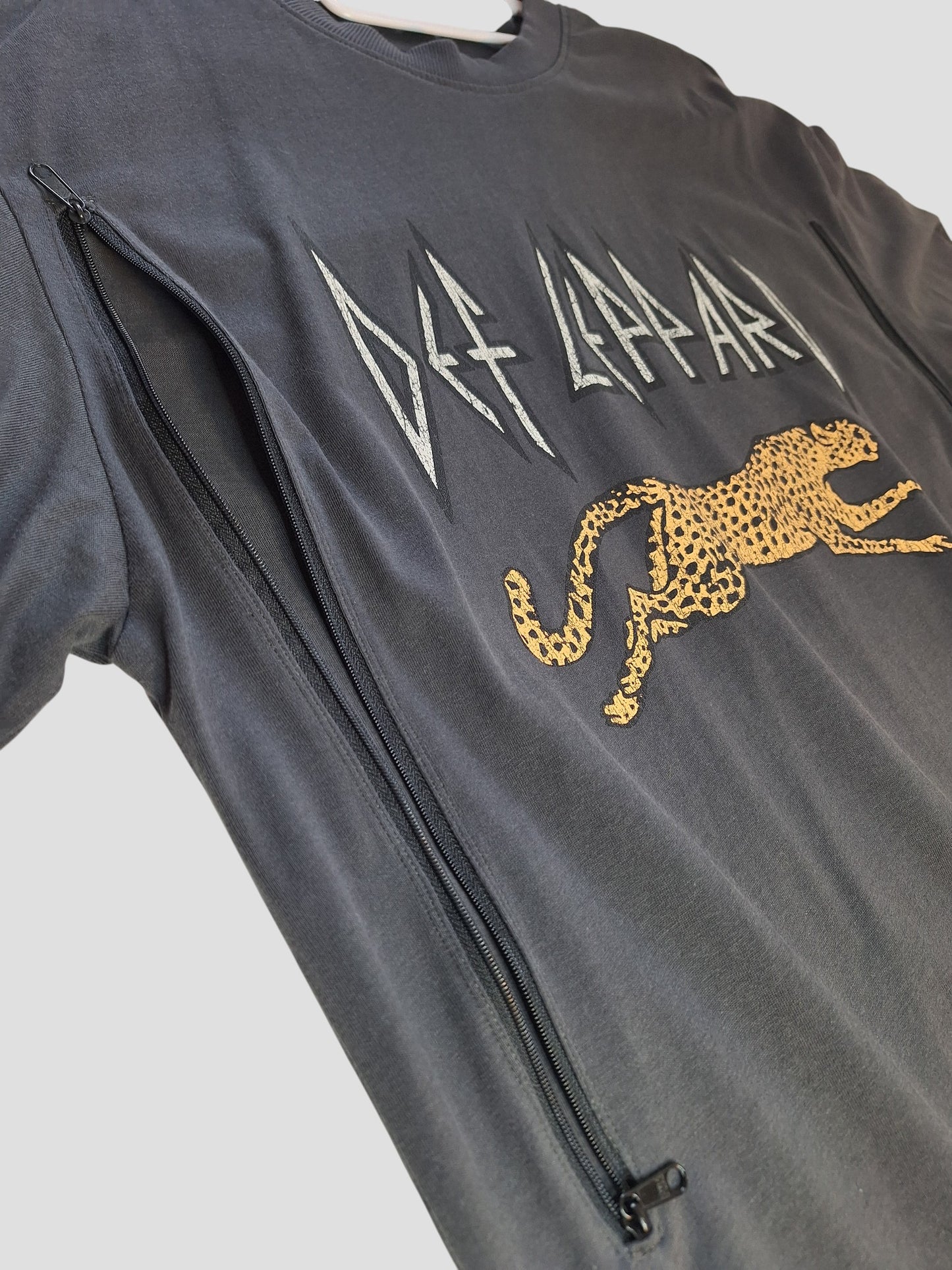 An upcycled grey Def Leppard band t-shirt by H&M (M, 100370) transformed into stylish breastfeeding and pumping clothing for modern moms.