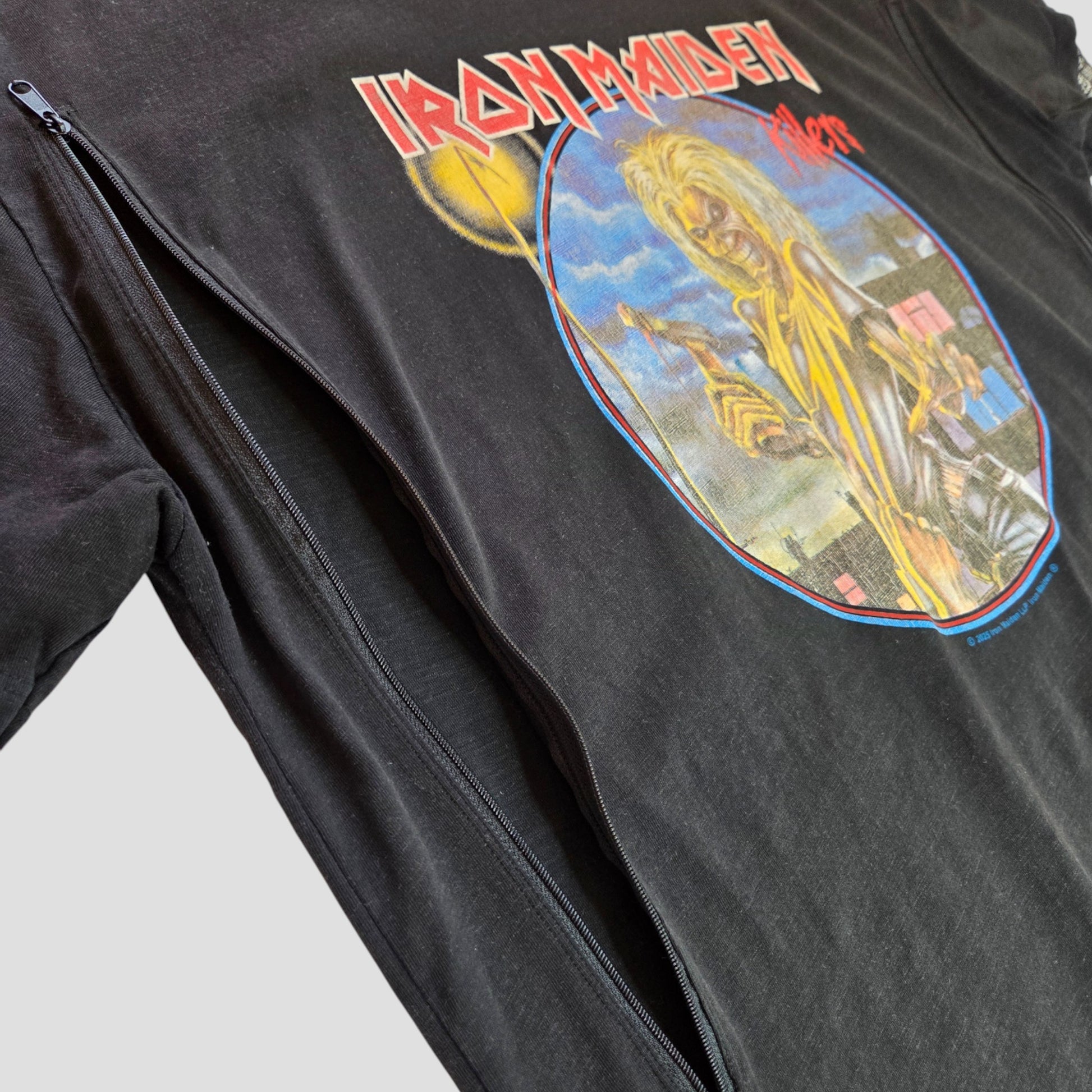 The Primark Upcycled Breastfeeding & Pumping Black Iron Maiden Oversized Band t-shirt (M, 100417) features Eddie with a weapon against a cityscape, plus a large side zipper for eco-friendly nursing.