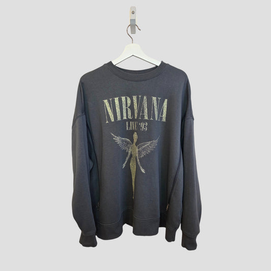 The Primark Upcycled Breastfeeding & Pumping Grey Nirvana Angel Band Sweatshirt XL (100419) features “NIRVANA LIVE ‘93” text and an angel graphic, crafted from upcycled nursing wear and shown on a white hanger with a light gray background.