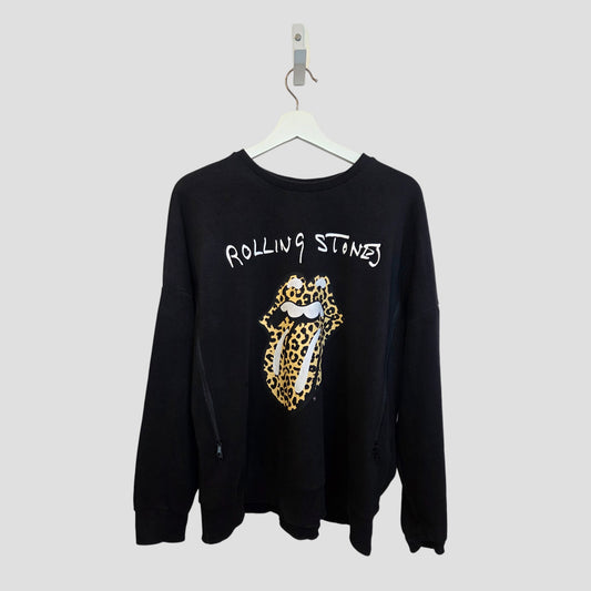 The Rolling Stones Upcycled Breastfeeding & Pumping Black Leopard Band Sweatshirt UK14 (100411) features the band’s iconic tongue logo with leopard print and is displayed on a white hanger against a plain background.
