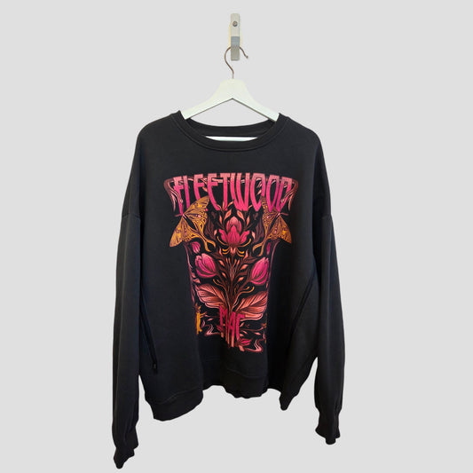 The Primark Upcycled Breastfeeding & Pumping Floral Fleetwood Mac Band Sweatshirt XL (UK18/20) features a colorful, psychedelic floral and moth graphic and hangs on a white hanger against a plain light gray background.