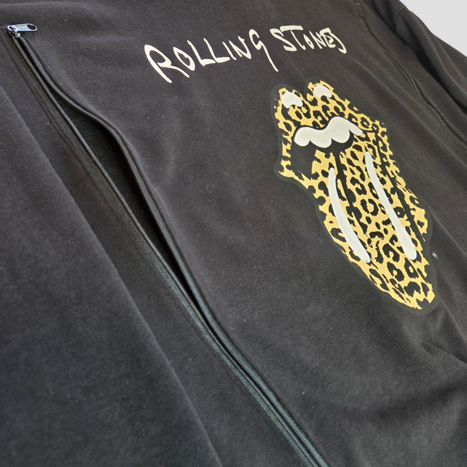 Upcycled black Rolling Stones Leopard Band Sweatshirt (UK14) by The Rolling Stones—features white logo and mouth graphic with yellow/black leopard print tongue. Eco-friendly, affordable maternity option, designed for breastfeeding and pumping.