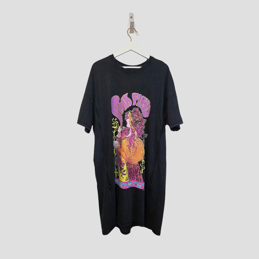 The Primark Upcycled Breastfeeding & Pumping Pink Floyd Band T-shirt dress (L, UK14/16) hangs on a white hanger, displaying a vibrant psychedelic graphic—an affordable, stylish nursing wear choice.