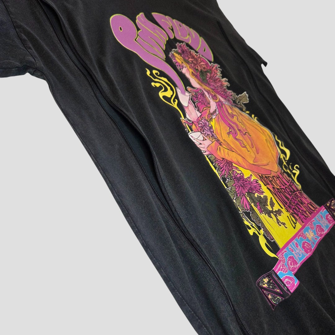 The Primark Upcycled Breastfeeding & Pumping Pink Floyd Band t-shirt dress (L/UK14/16) features a vibrant vintage graphic with floral accents and a woman in an orange dress, displayed flat on a light gray background.