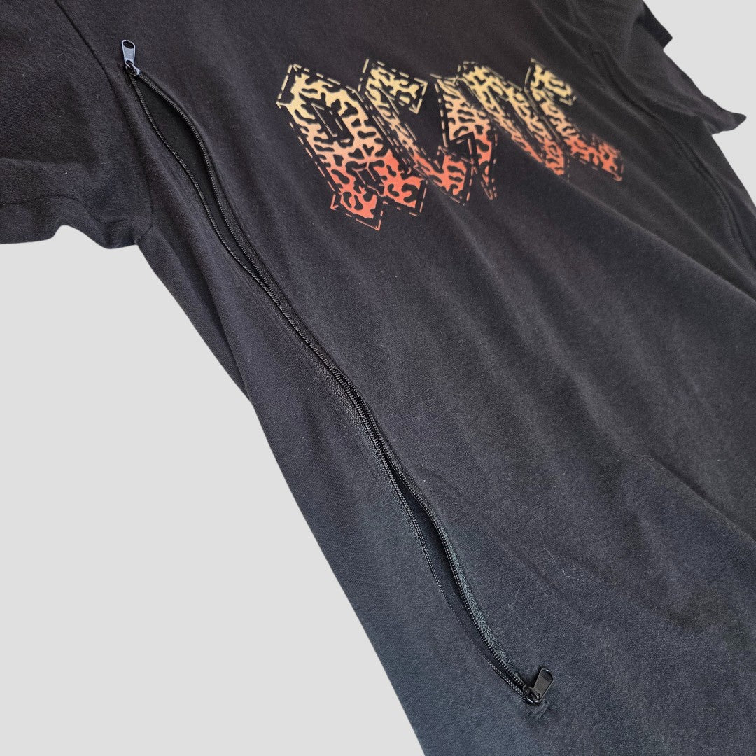 The Upcycled Breastfeeding Black Leopard AC/DC Band t-shirt (L) features a unique animal print graphic and a long black diagonal zipper for easy nursing, combining rock style and practicality. Shirt is shown laid flat on a light background.