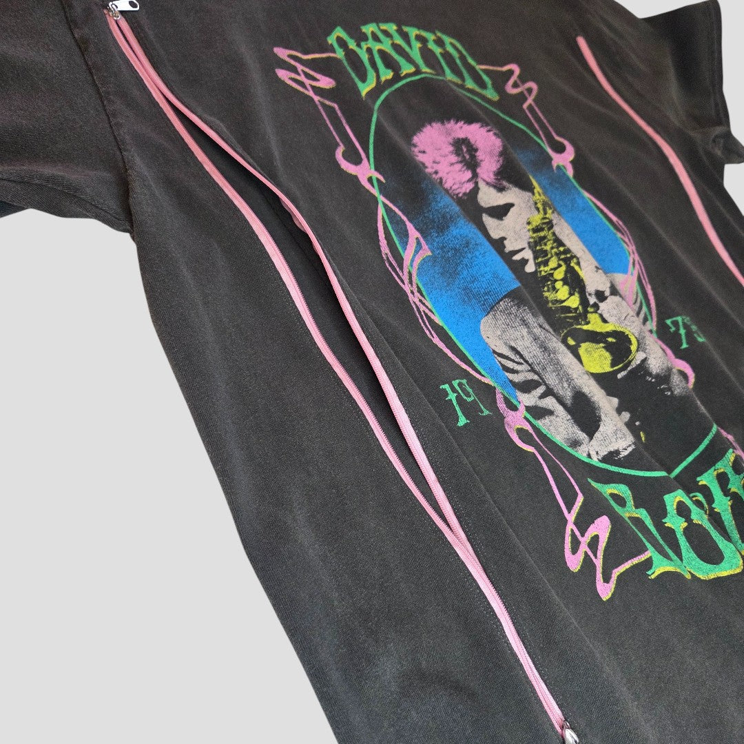 The David Bowie Upcycled Breastfeeding & Pumping t-shirt (M/L) features a colorful pink-haired graphic, “David” and “Love” text, two pink zippers for nursing, and combines style with function. Laid flat on a light background.